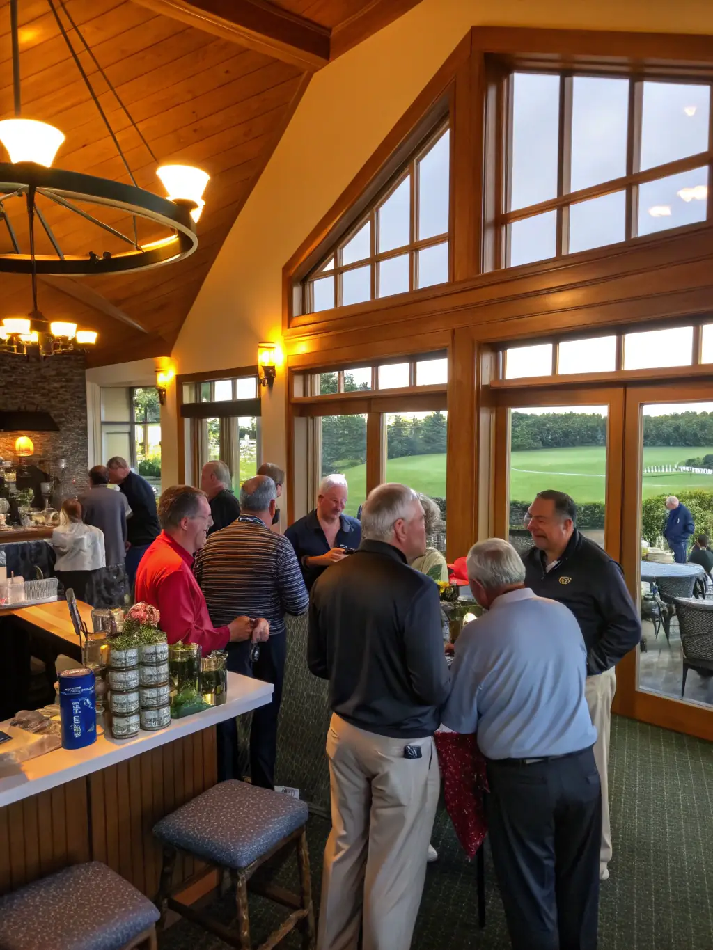 A vibrant photo of the Hollytree clubhouse, highlighting its elegant architecture and the social activities taking place within, emphasizing the community's active social scene.